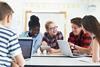 Photo of teenage students in a classroom.