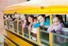 Photo of a school bus with children.  Caption