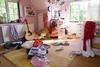 Photo of a very messy and untidy child's bedroom.