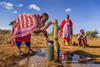 African woman getting water from well