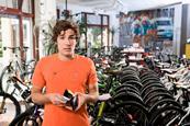 Teenage boy deciding if he should buy a bike