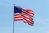 American flag waving on pole