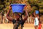 African woman carrying water