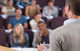 Photo of a teacher and their students.