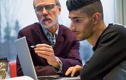 Photo of a teacher and a student.