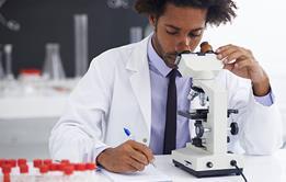 Photo of scientists working in a lab or of instruments used by scientists.