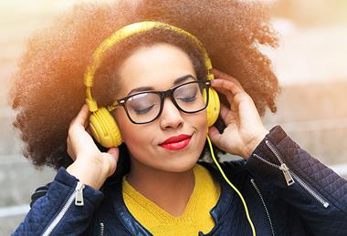Photo of people listenint to music or someone speaking.