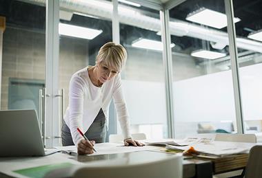 Photo of people in a working/professional context. E.g.: having a meeting, or working in an office.