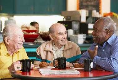 Three old friends having coffee