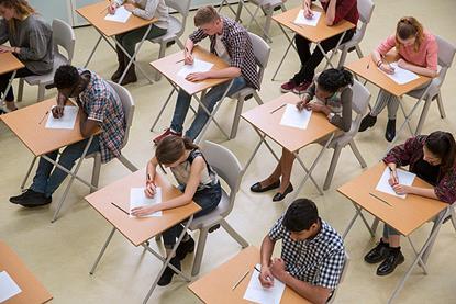 Photo of students sitting an exam or photo of the exam's name: IELTS.