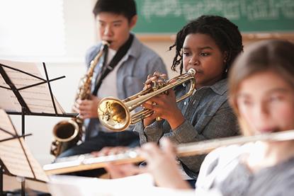 Photo of students playing musical instruments.