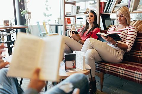 Photo of a group of students reading,  can be a group or just a couple of them