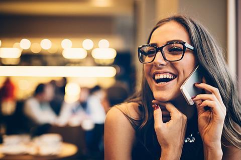 Photo of two people chatting, or speaking over the phone updating each other.