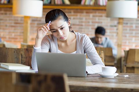 Photo of a student/students looking discouraged or struggling with something.