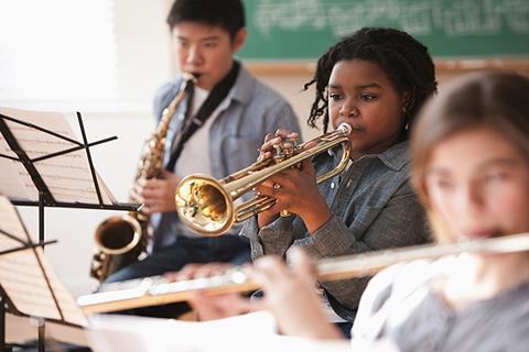 Photo of students playing musical instruments.