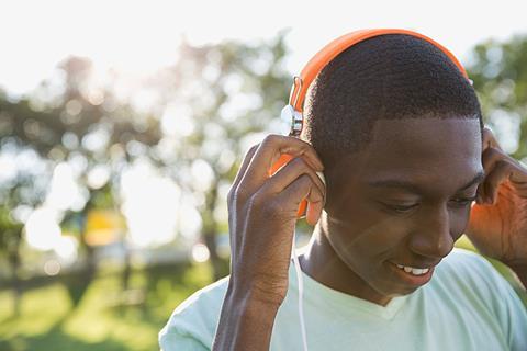 Photo of teenagers listening to music