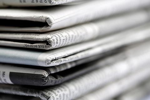 Photo of newspapers, a radio  or a magazine to illustrate the concept of media.