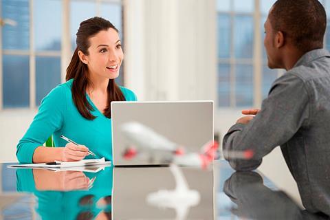 Photo of a teacher and a student having a formal conversation, e.g.: in an exam environment. If too hard, then just a teacher and a student having a conversation.