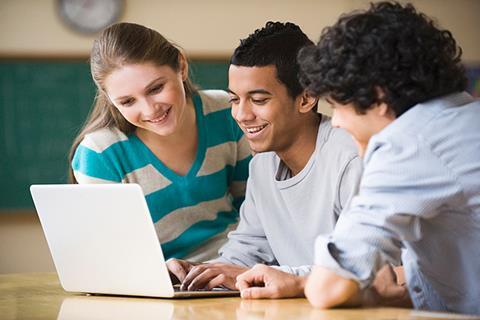 Photo of students doing an activity together in the classroom.