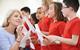 Photo of a group of children and their teacher singing in a classroom.  If too hard, just a photo of children singing.