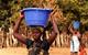 African woman carrying water