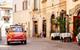 Car driving through streets in Italy